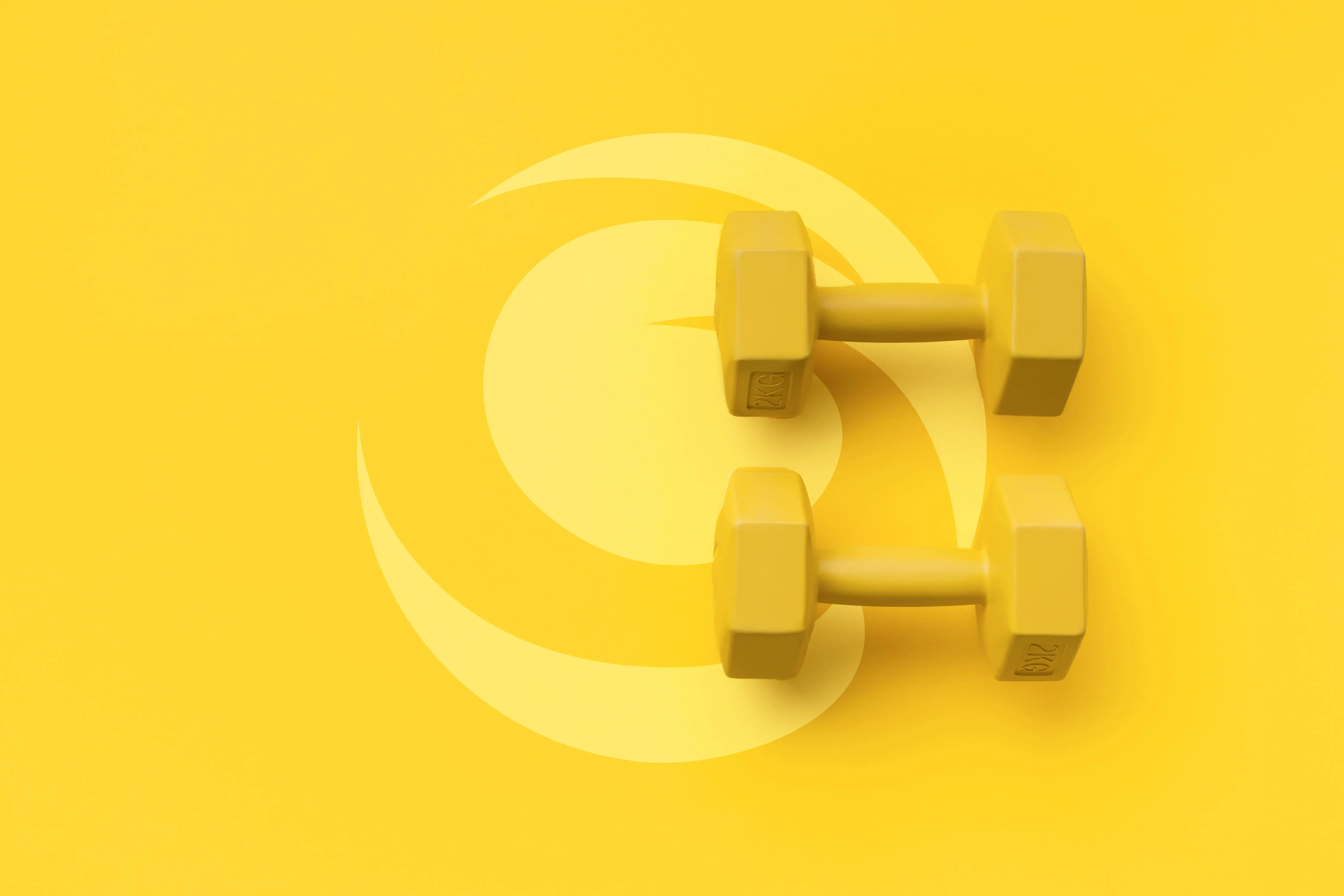 Yellow dumbbell weights laying across the Golden Coast Finance icon symbolizing financial fitness. 