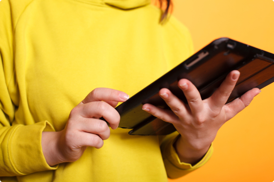 Close-up of hands holding up a black iPad  with content about mortgage refinancing. 